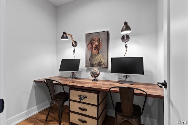 office with dark hardwood / wood-style flooring