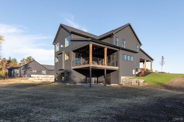 rear view of house with a balcony