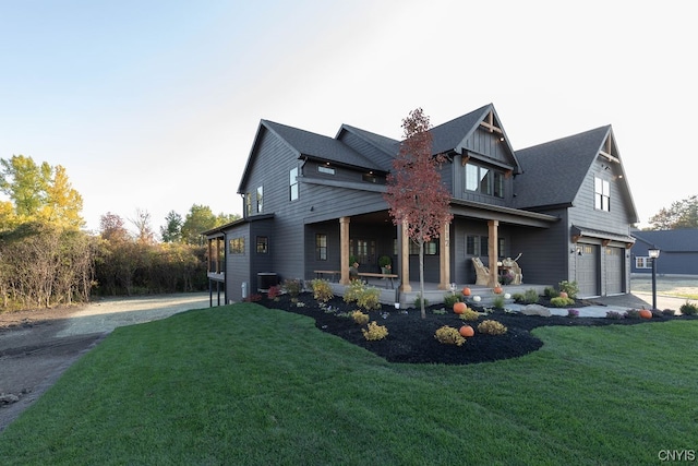 view of home's exterior with a lawn, central AC unit, and a garage