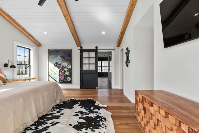 bedroom featuring ceiling fan, dark hardwood / wood-style flooring, and lofted ceiling with beams