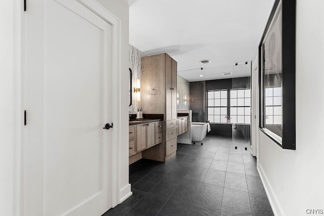 bathroom featuring vanity and tile floors