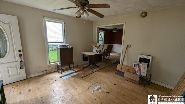 miscellaneous room with heating unit and ceiling fan