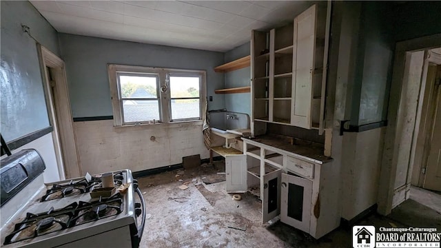 kitchen featuring white range with gas cooktop