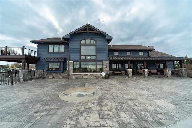 rear view of property featuring a patio area