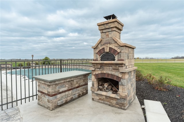 view of patio / terrace with an outdoor stone fireplace