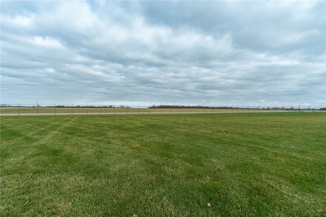 view of yard with a rural view