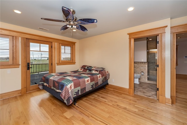 bedroom featuring connected bathroom, access to exterior, ceiling fan, and light hardwood / wood-style floors