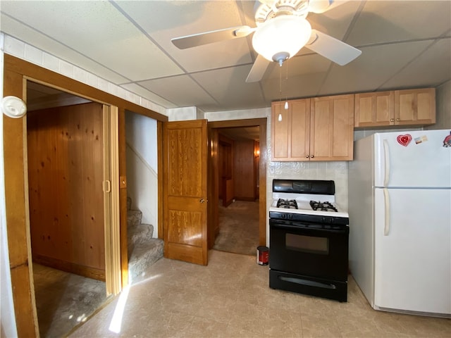 kitchen with a drop ceiling, light tile patterned flooring, ceiling fan, and white appliances