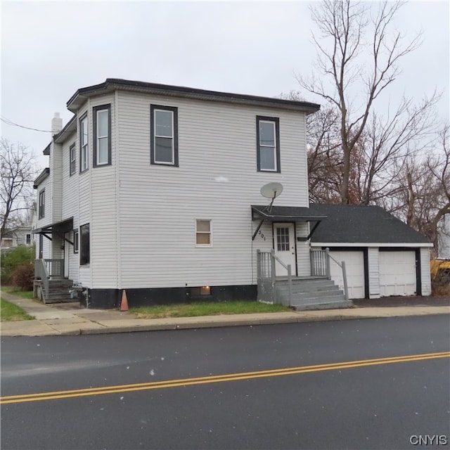 front facade with a garage