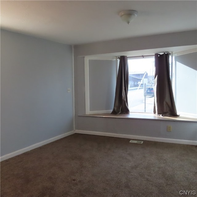 empty room featuring carpet flooring