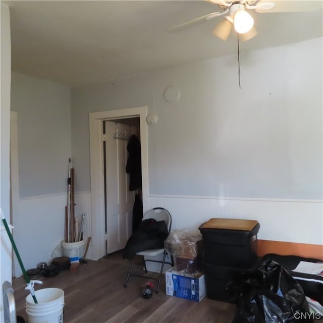 misc room with wood-type flooring and ceiling fan