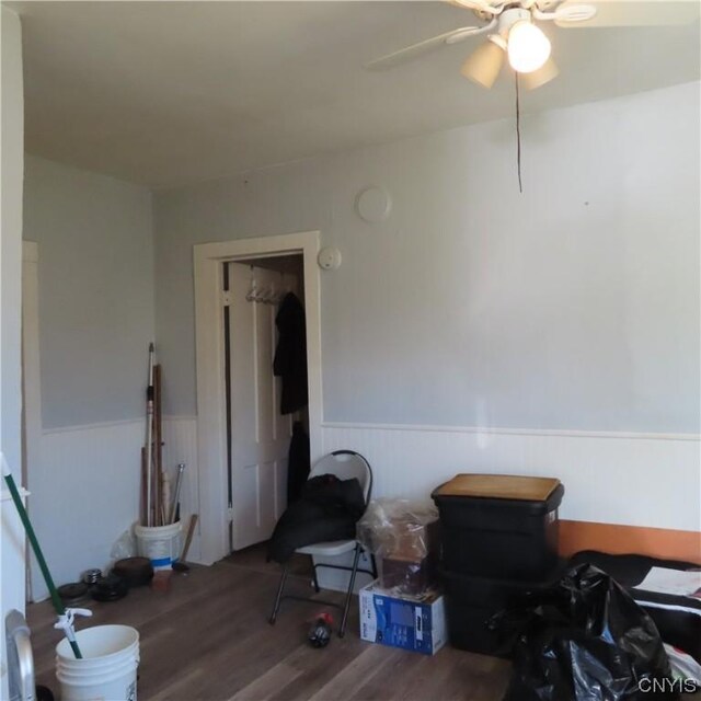 301 E Manlius St, Dewitt, NY 13057 - interior space featuring wainscoting, wood finished floors, and a ceiling fan