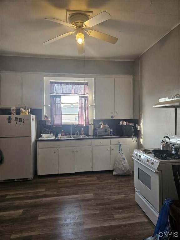 kitchen featuring white cabinetry, white appliances, dark wood-type flooring, ceiling fan, and sink