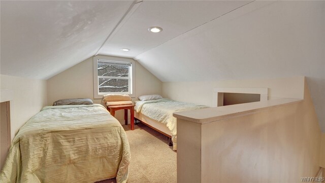 bedroom featuring carpet and vaulted ceiling