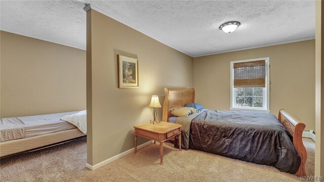 bedroom featuring carpet flooring, crown molding, baseboard heating, and a textured ceiling