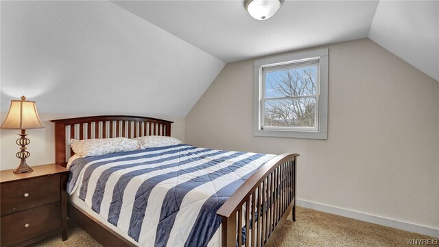 carpeted bedroom with vaulted ceiling