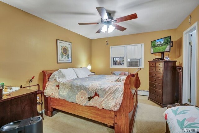 carpeted bedroom featuring ceiling fan and cooling unit