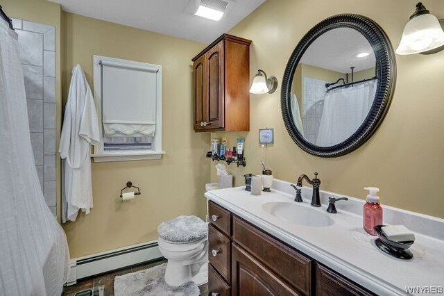 bathroom with baseboard heating, walk in shower, vanity, and toilet