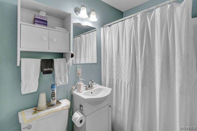 bathroom featuring vanity and toilet