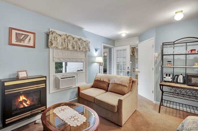 sitting room featuring carpet floors and cooling unit