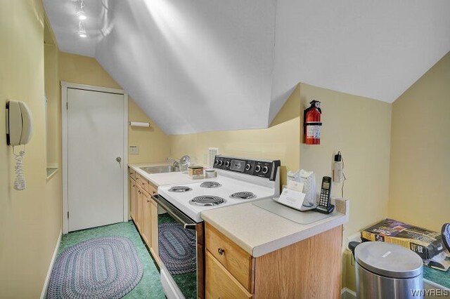 kitchen featuring light colored carpet, sink, lofted ceiling, and white electric stove