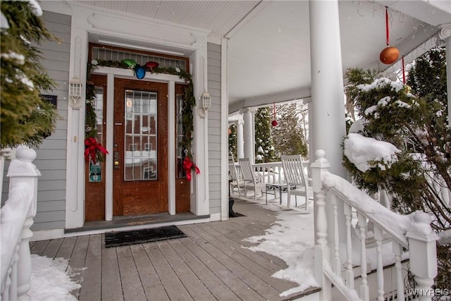 doorway to property featuring covered porch