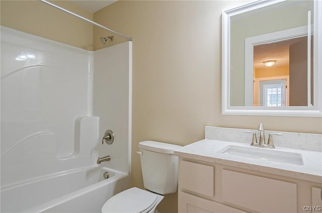 full bathroom featuring toilet, vanity, and bathing tub / shower combination