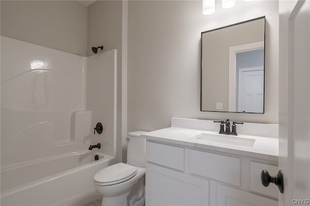 full bathroom featuring toilet, vanity, and  shower combination