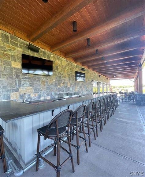 view of patio with an outdoor bar