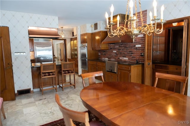 dining room featuring a notable chandelier