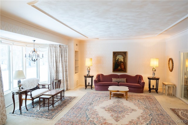 carpeted living room with crown molding and a chandelier