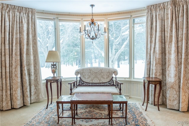 sunroom / solarium with a chandelier