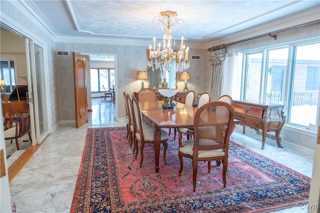 dining area with an inviting chandelier and crown molding