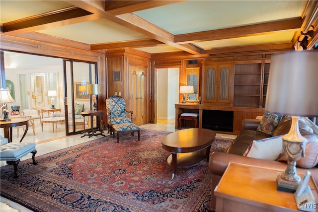 living room with coffered ceiling, wood walls, light tile patterned floors, and beam ceiling