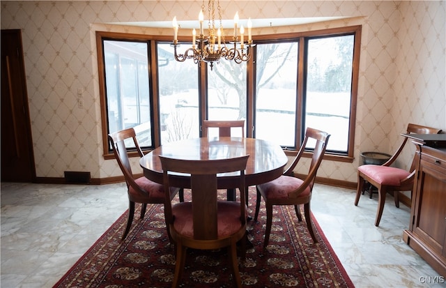 dining space with a chandelier