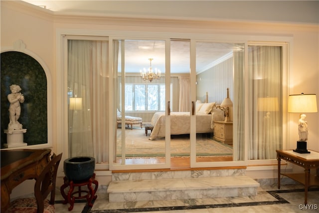 bedroom featuring ornamental molding and an inviting chandelier