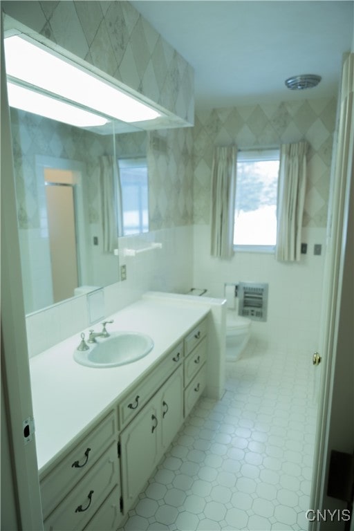 bathroom with toilet, walk in shower, and vanity