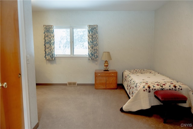 bedroom with light carpet