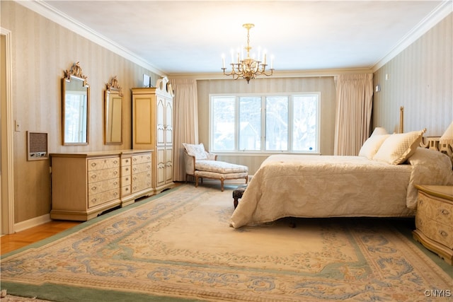 bedroom with ornamental molding, an inviting chandelier, and hardwood / wood-style floors