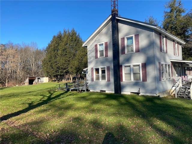 back of house featuring a lawn