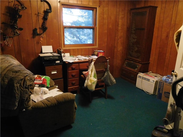 home office with carpet and wooden walls