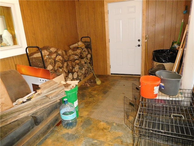 miscellaneous room featuring wooden walls