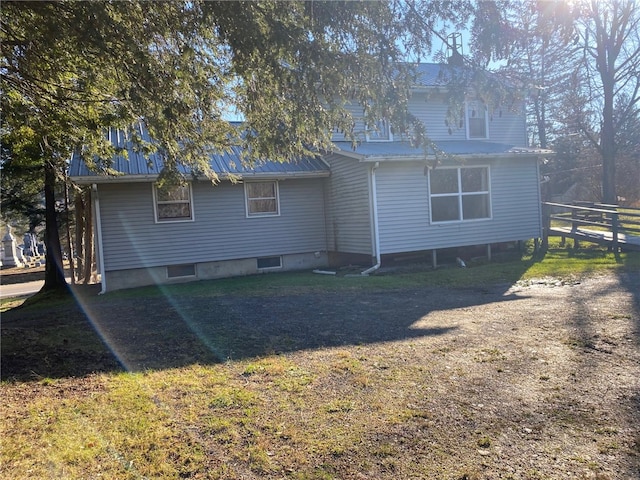 rear view of property with a yard