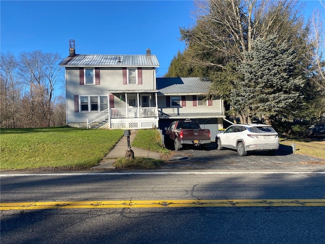 view of front of home with covered porch and a front yard