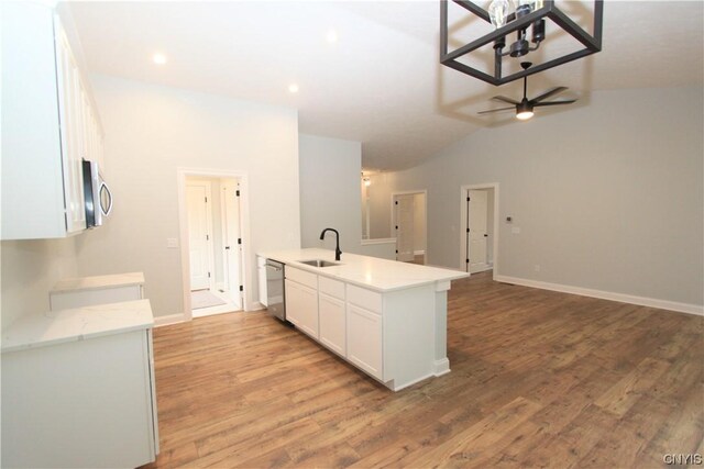 LOT214 Tall Tree Ln, Lysander, NY 13027 - kitchen with a sink, a peninsula, appliances with stainless steel finishes, open floor plan, and white cabinetry