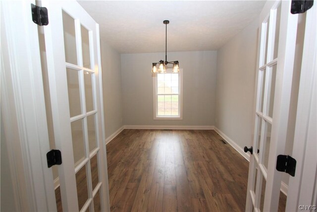 LOT214 Tall Tree Ln, Lysander, NY 13027 - spare room with baseboards, a notable chandelier, french doors, and wood finished floors