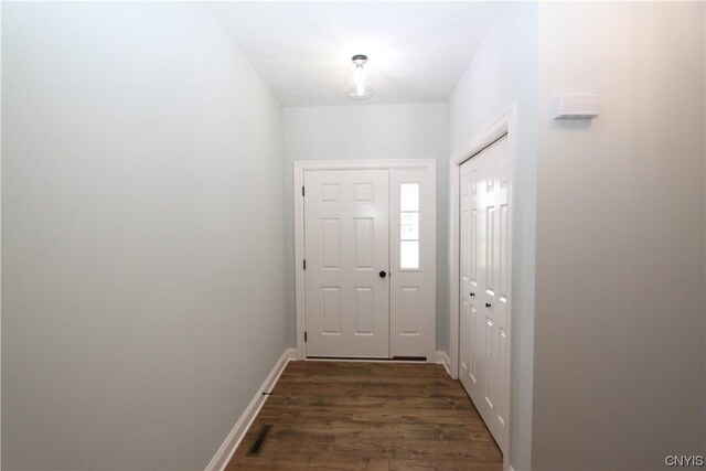 LOT214 Tall Tree Ln, Lysander, NY 13027 - doorway to outside with dark wood finished floors and baseboards