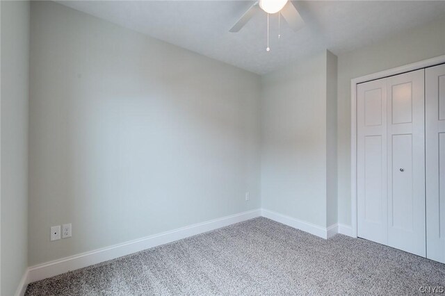 LOT214 Tall Tree Ln, Lysander, NY 13027 - unfurnished bedroom with baseboards, carpet floors, a ceiling fan, and a closet