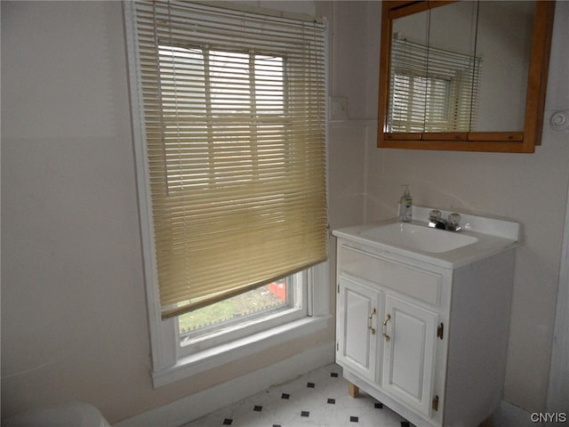 bathroom with oversized vanity and tile flooring