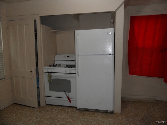 kitchen with white appliances and light tile floors